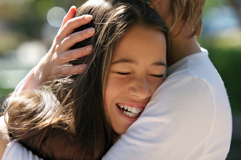 Two friends hugging