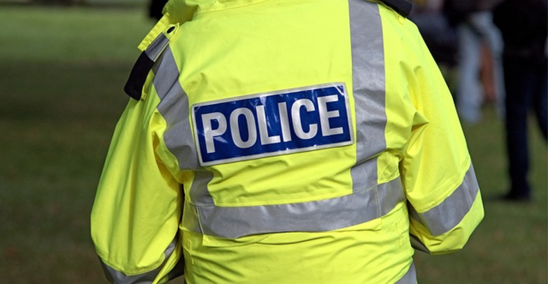 A police jacket saying 'police'