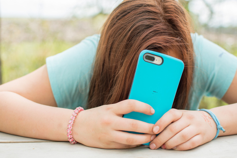 Young person holding a smart ohone
